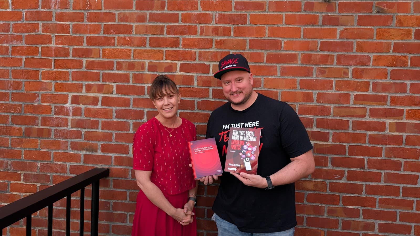 Jeff J Hunter with Dr. Karen E. Sutherland, holding both of her Palgrave textbooks
