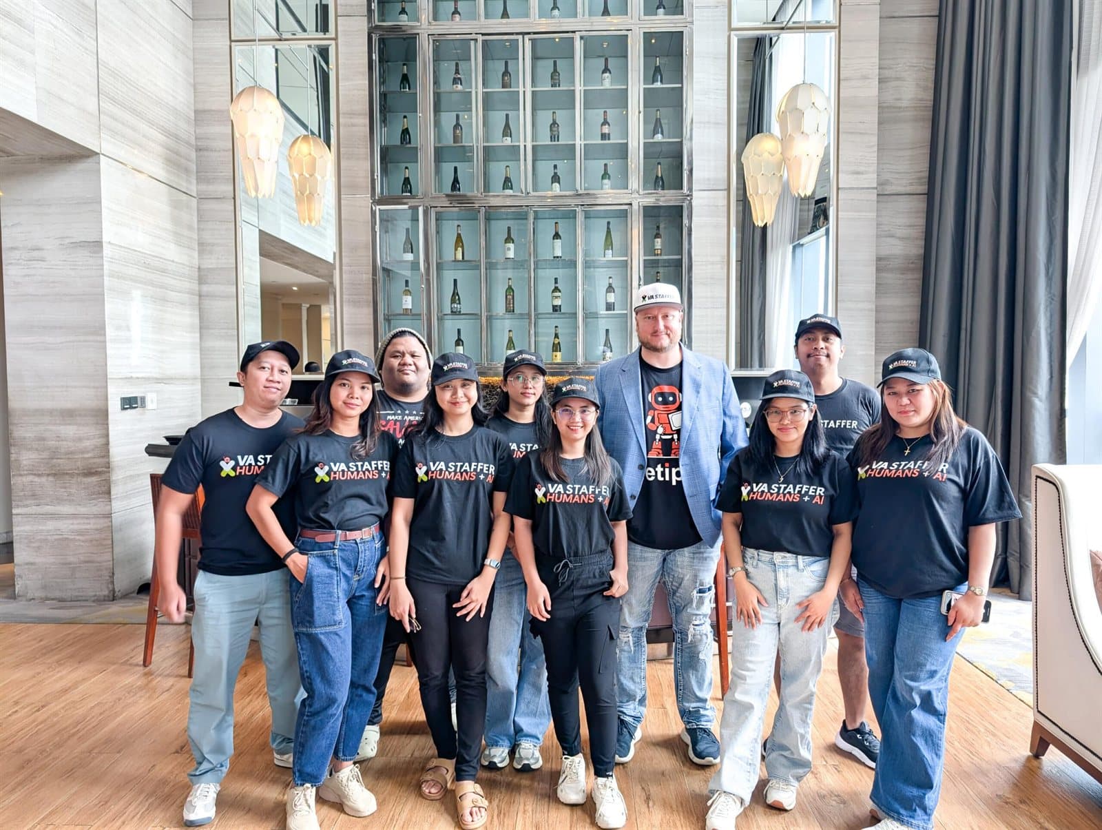 The VA Staffer team in the Philippines, in Humans + AI shirts, with Jeff J Hunter